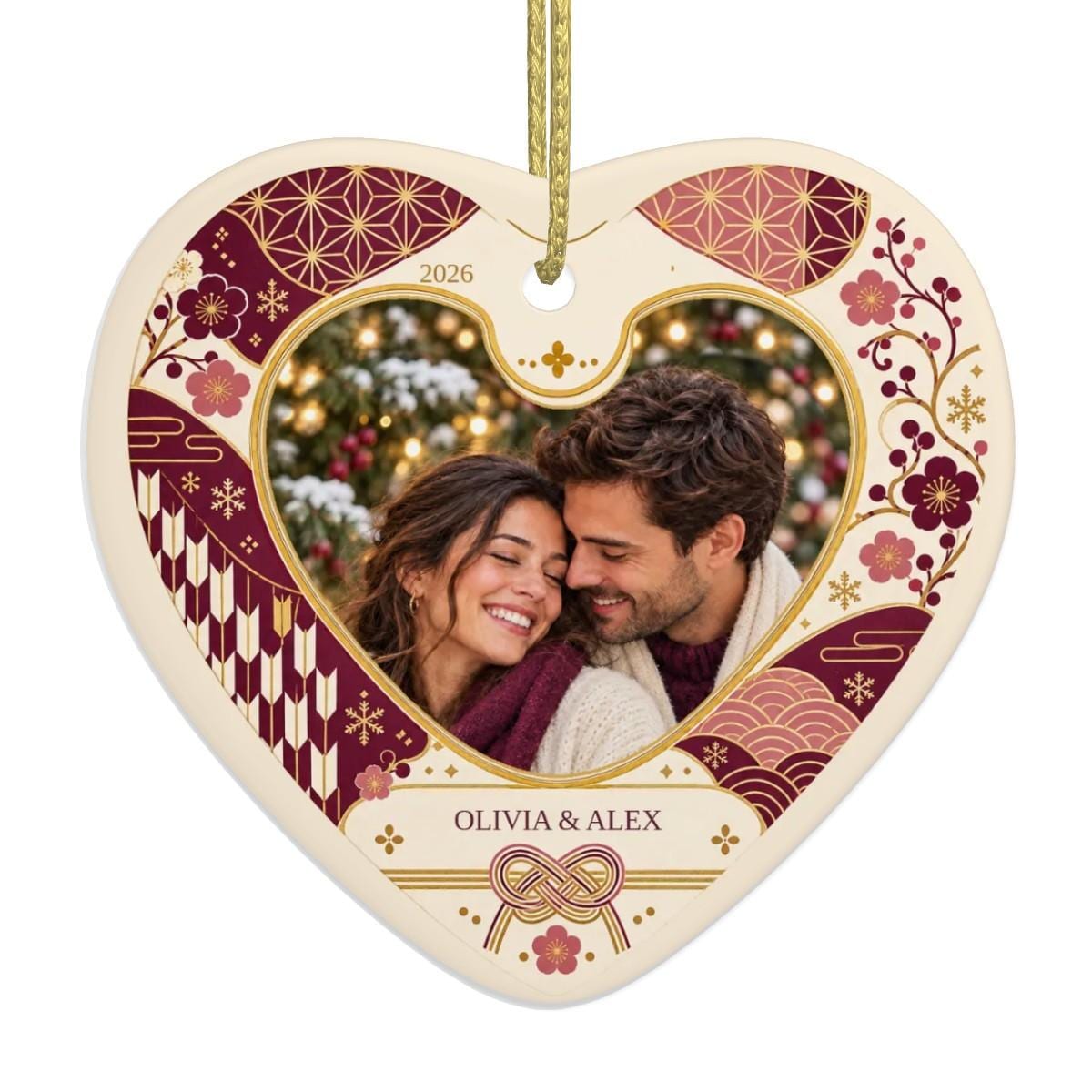Personalized couple photo ornament: ceramic heart with a sample couple photo, the names OLIVIA & ALEX and 2026 in a plum and pink Japanese floral frame with a knot motif, a couples Christmas ornament keepsake.