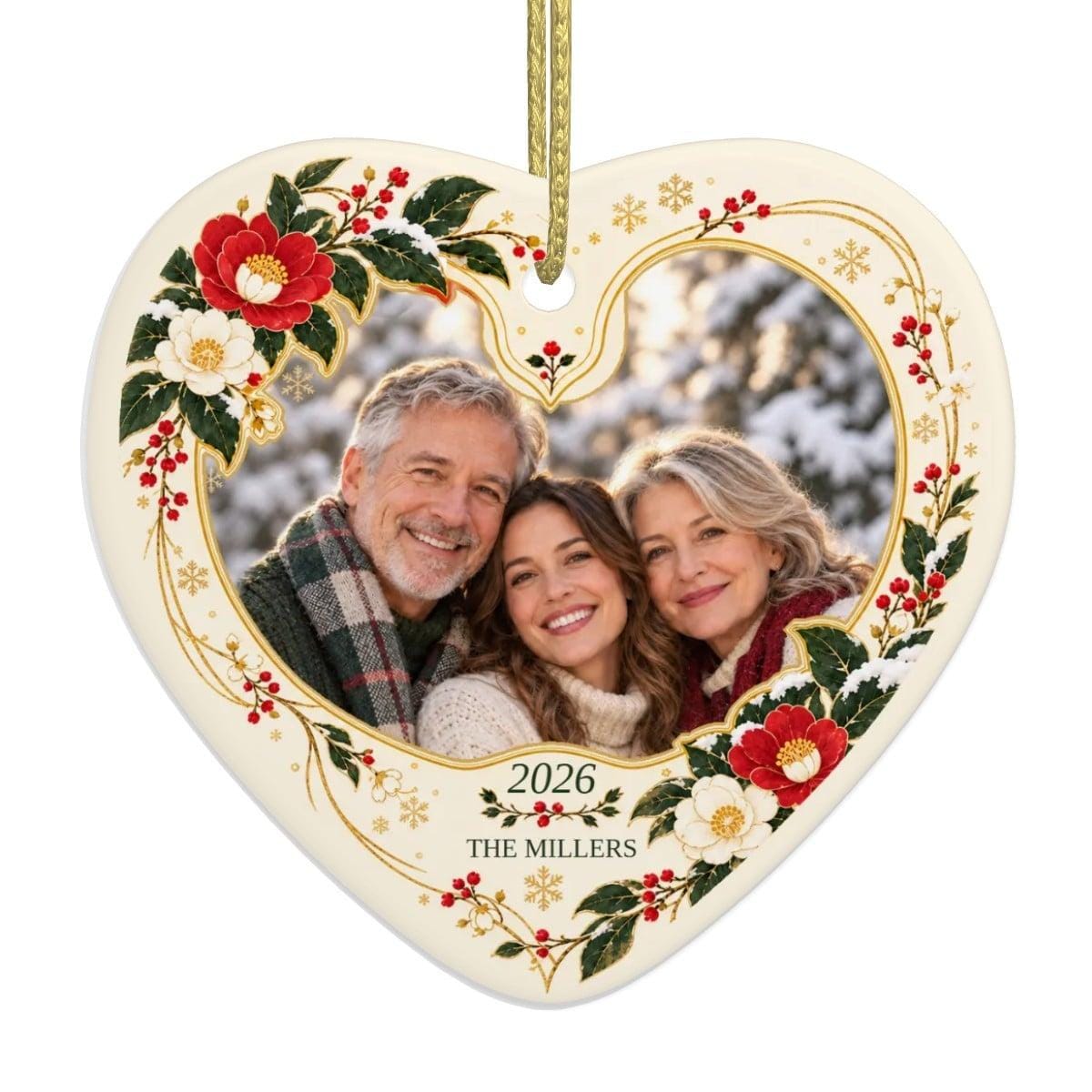 Personalized family photo ornament: ivory ceramic heart with a sample family photo, 2026 and THE MILLERS, framed by red camellias and gold Japanese lines, a family Christmas ornament keepsake.